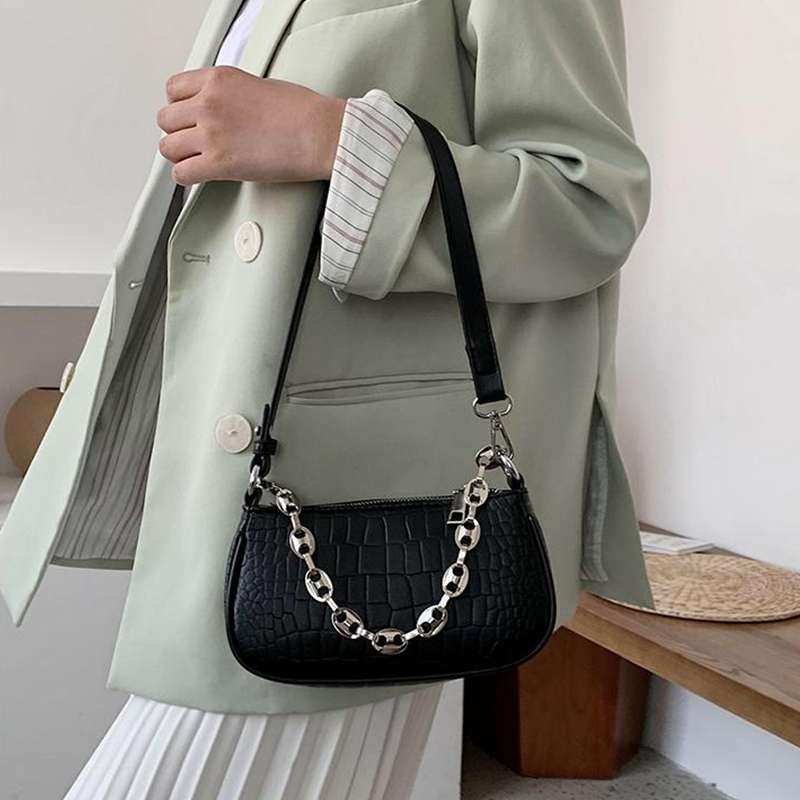 woman black croc embossed handbags
