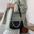 woman black croc embossed handbags